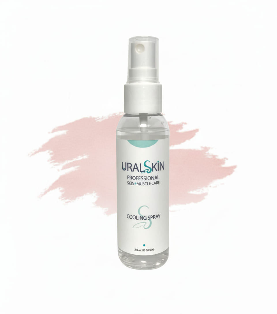 URALSKIN Cooling Spray bottle on a white background with soft pink brushstrokes
