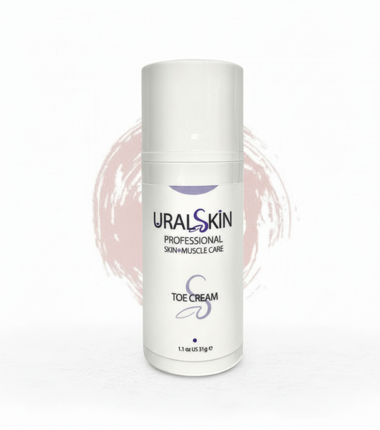 URALSKIN Toe Cream bottle on a white background with a soft rose brushstroke behind